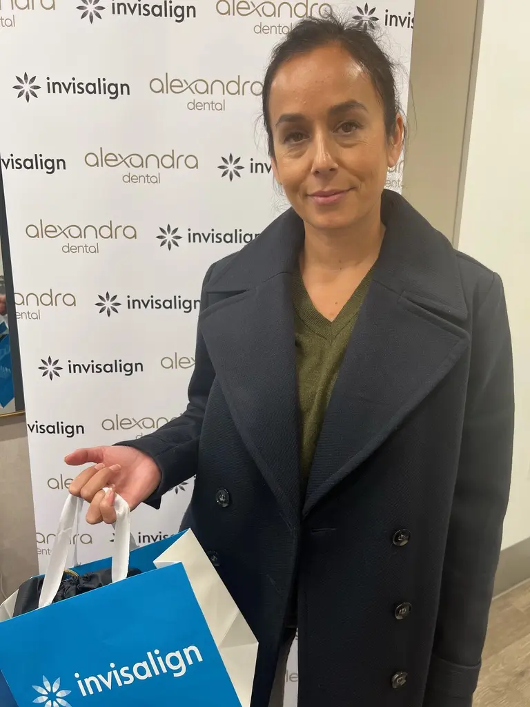 Alexandra Dental patient collecting their Invisalign aligners