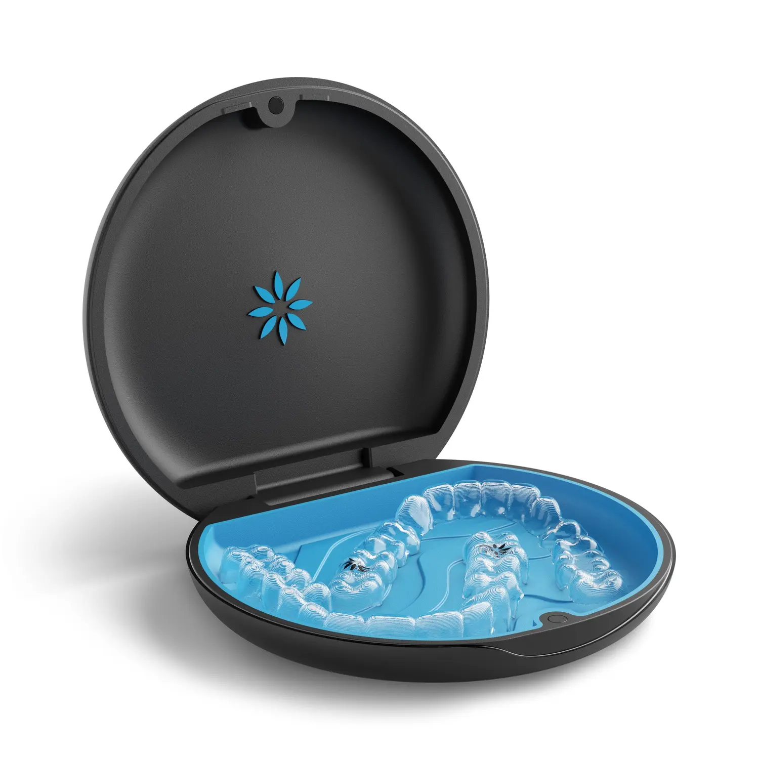 Open black Invisalign case containing clear aligners