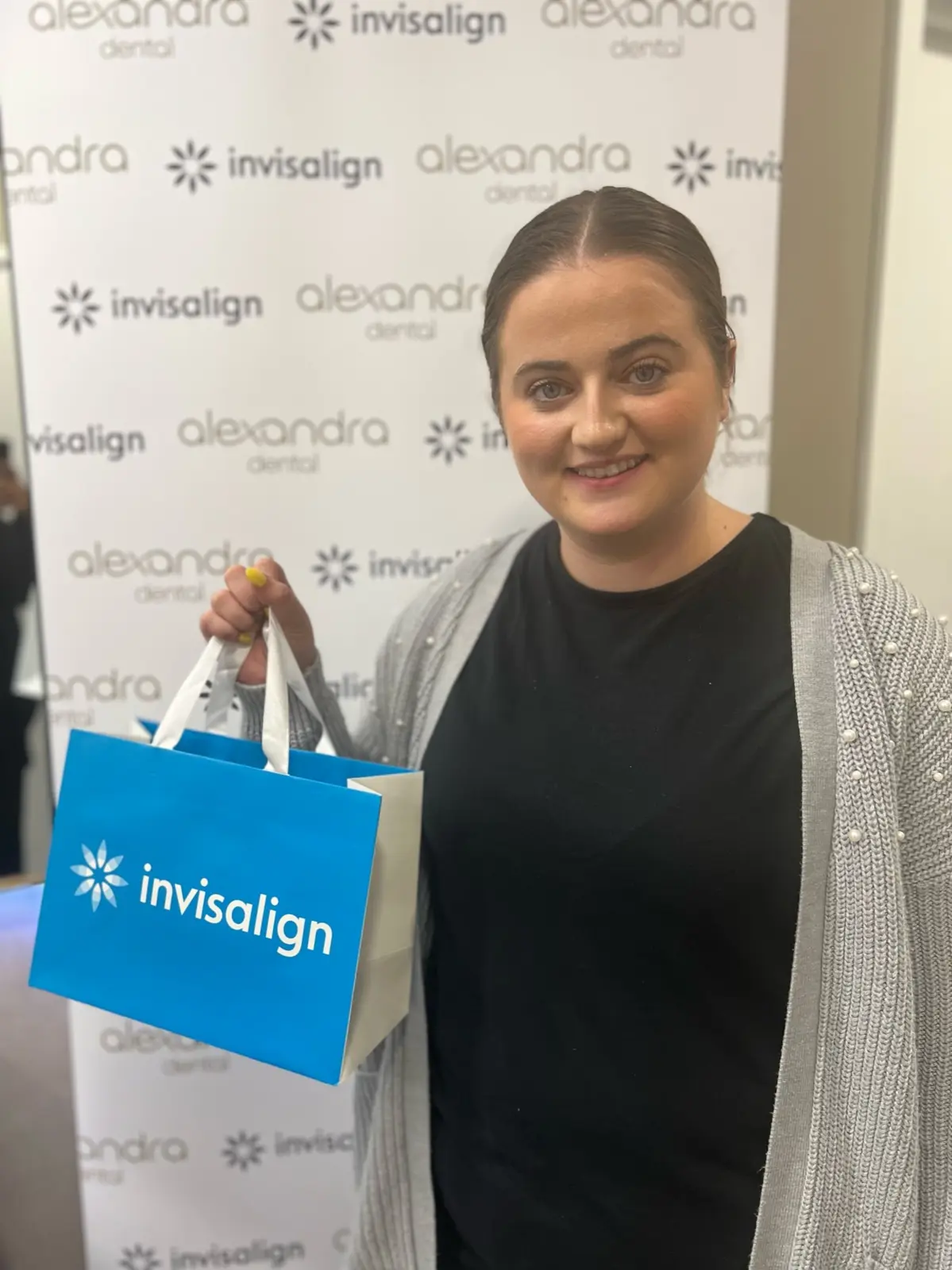 Alexandra Dental patient collecting their Invisalign aligners