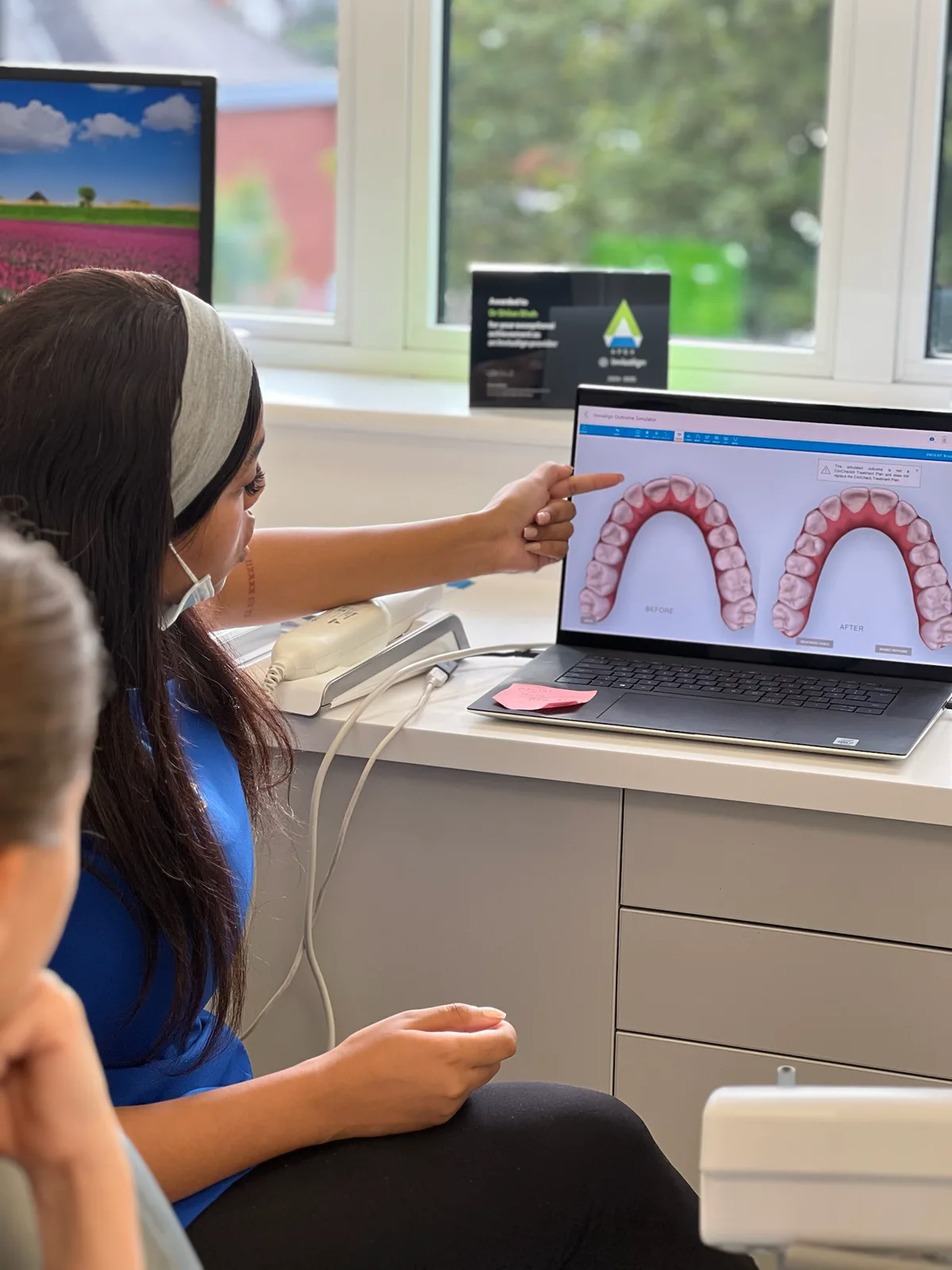 DNTL Group clinician explaining a digital smile plan to a patient