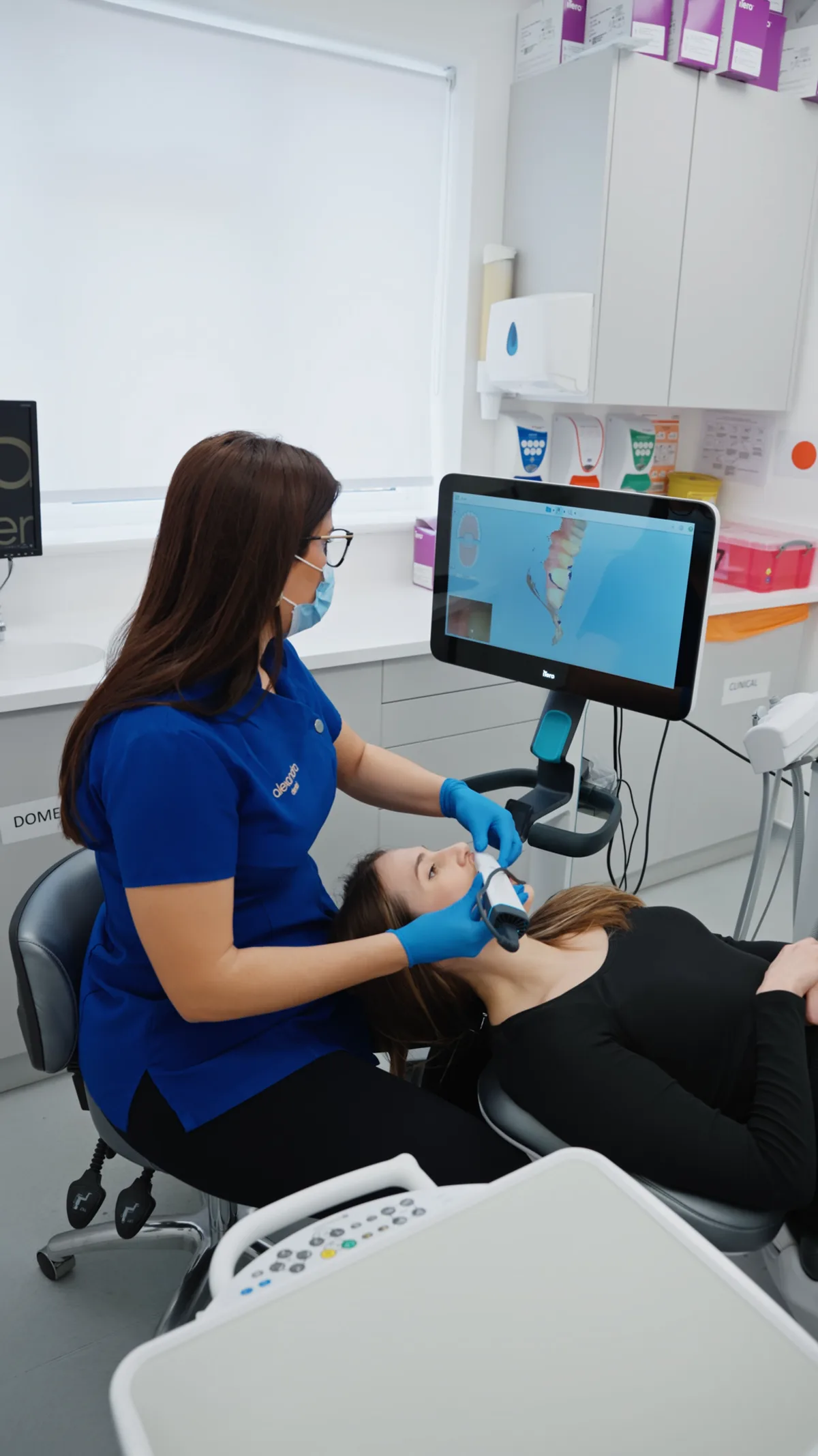 Clinician carrying out an iTero digital scan for an Invisalign patient